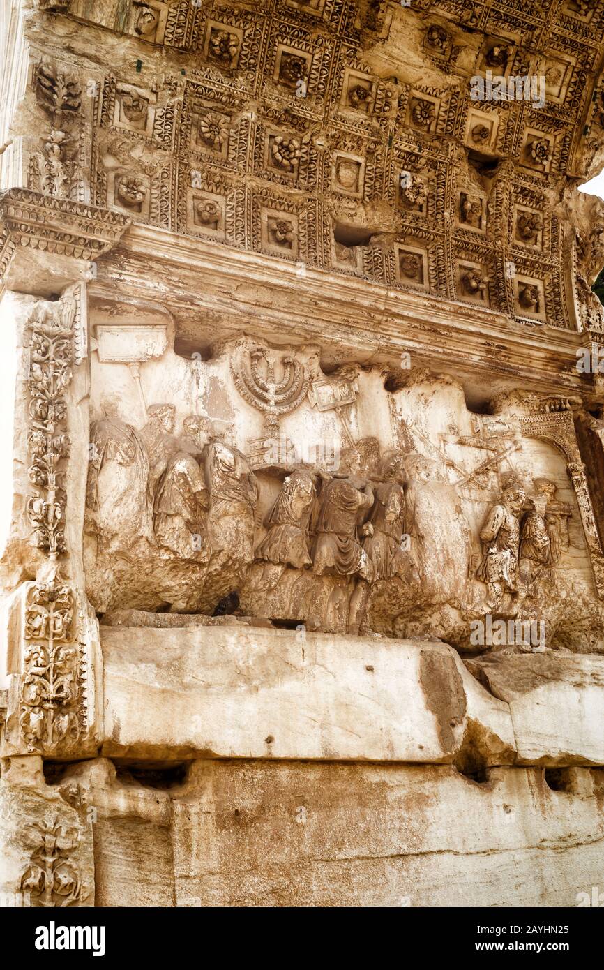 The Triumphal Arch of Titus by the Roman Forum. Detail with the Roman conquest of Jerusalem. Rome, Italy. Stock Photo