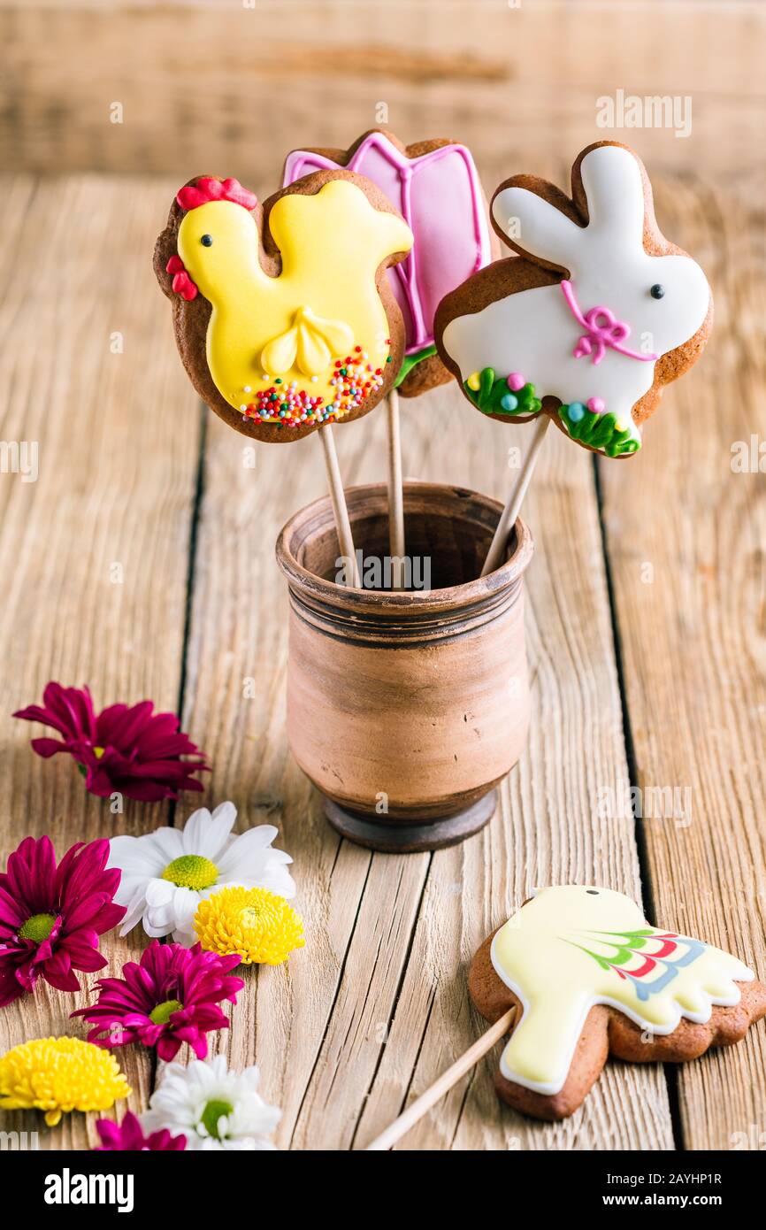 Easter cookies birds and rabbit on a wooden table with copy space. Spring Baking Theme Stock Photo