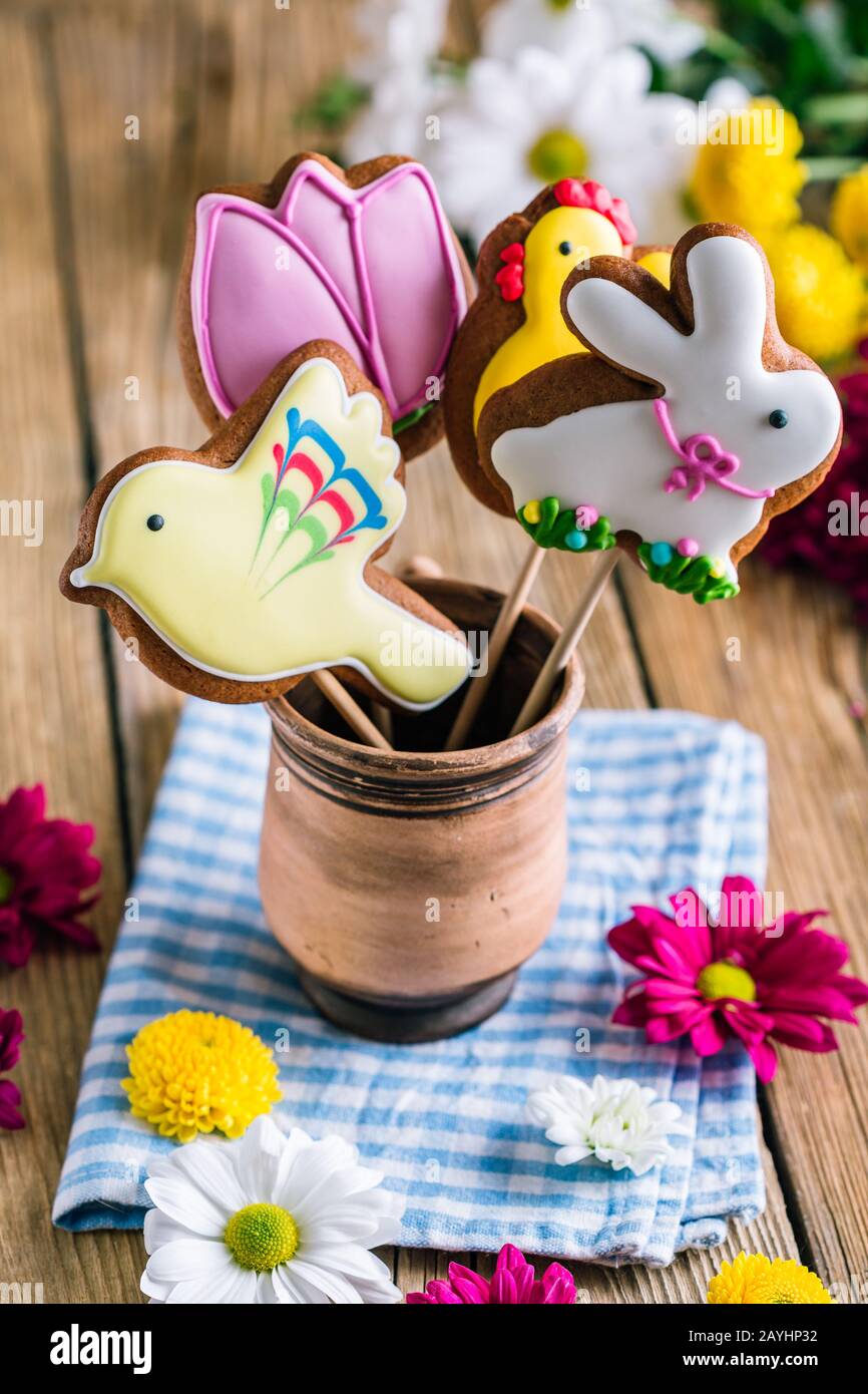 Easter cookies birds and rabbit on a wooden table with copy space. Spring Baking Theme Stock Photo