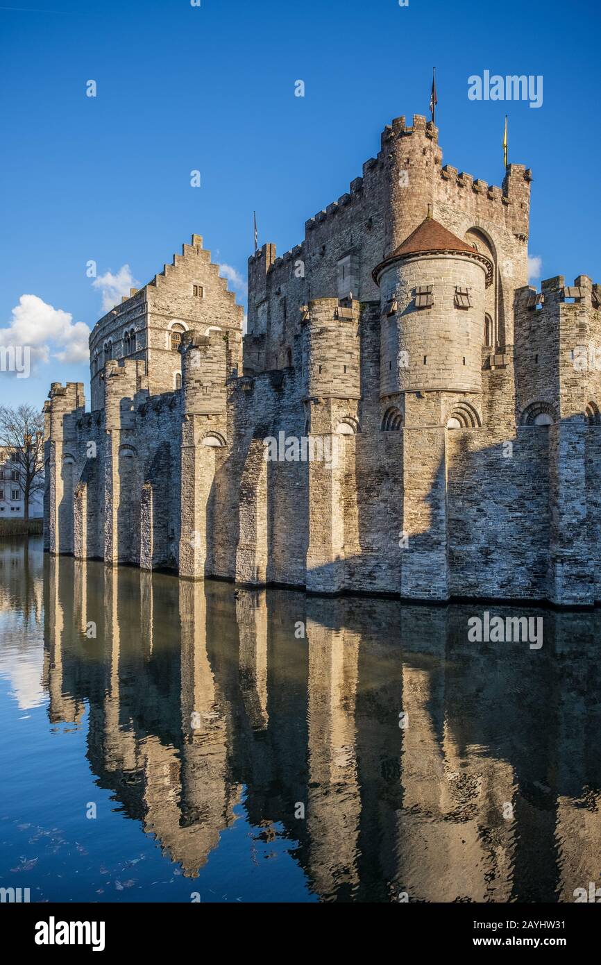 Gravensteen Castle and its reflection on the canal on a glorious blue sky day, Ghent Stock Photo