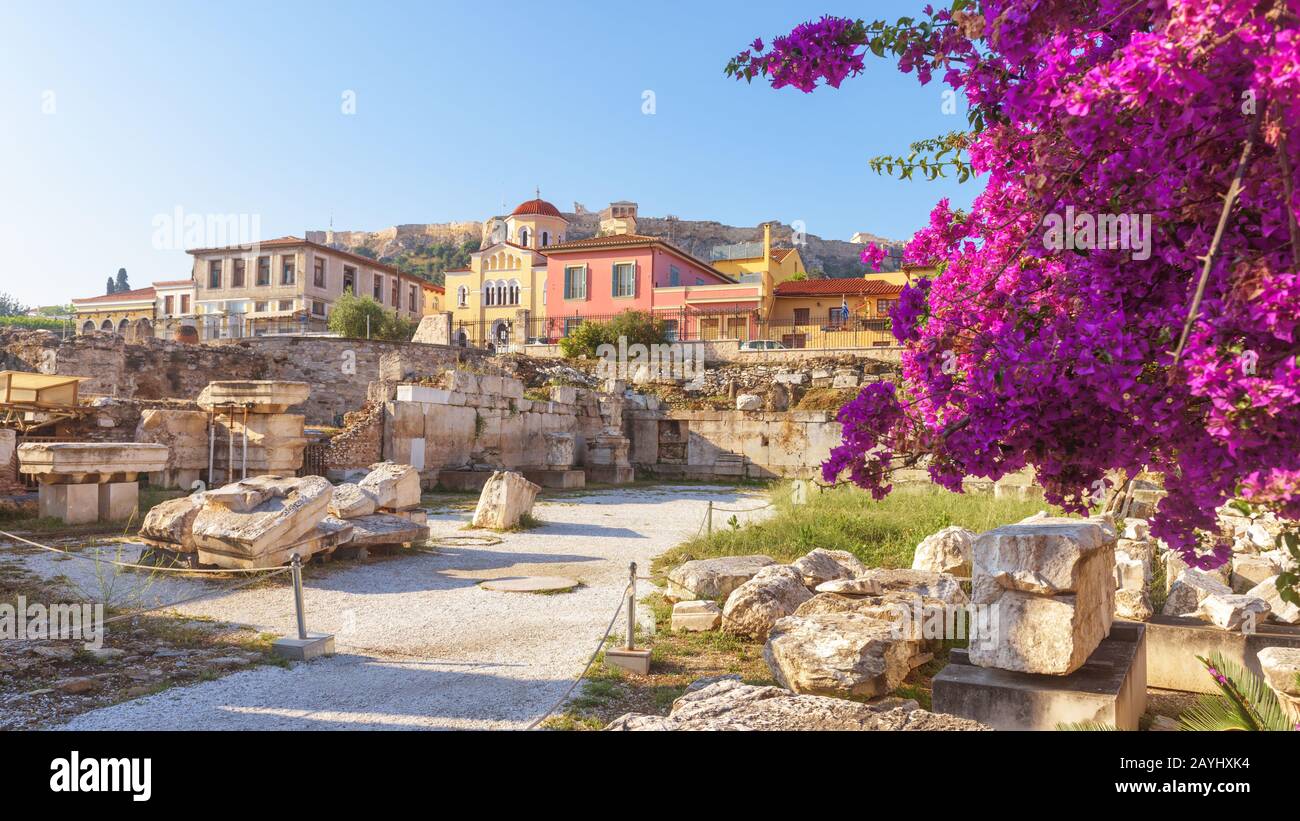 Sunny panoramic view of the Library of Hadrian, Athens, Greece. It is one of the main landmarks of Athens. Beautiful scenery of Athens with ancient Gr Stock Photo