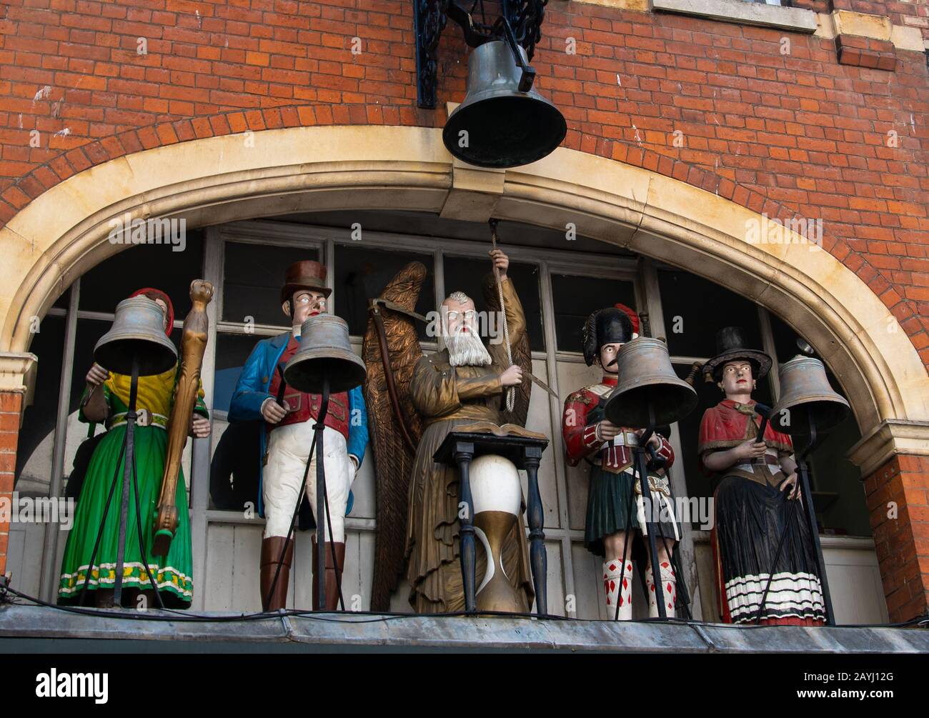 Gloucester, United Kingdom - September 08 2019:  The figures of the Baker's Clock built in 1904 with An Irishwoman, an Englishman, Old Father Time, a Stock Photo