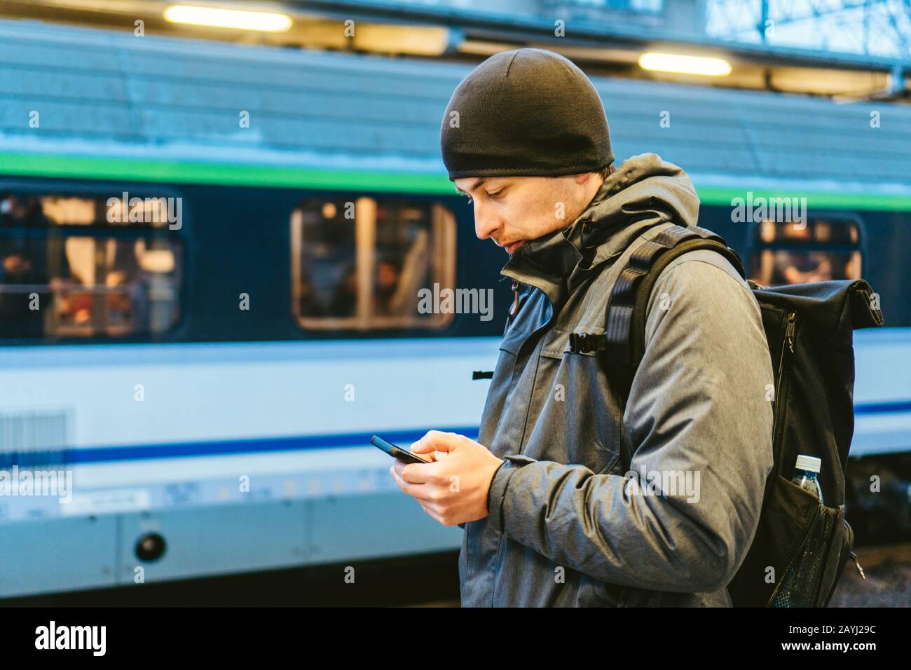 Sopot Railway station. traveler waiting for transportation. Travel concept. Man at the train station. Portrait Caucasian Male In Railway Train Station Stock Photo