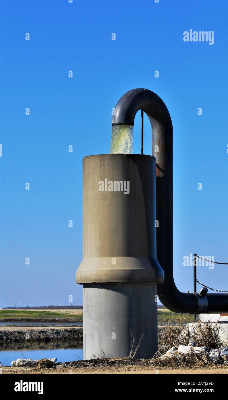 Pumped farm water in the Central Valley of California during multi year drought for food and farming and eating and live stock cattle etc Stock Photo
