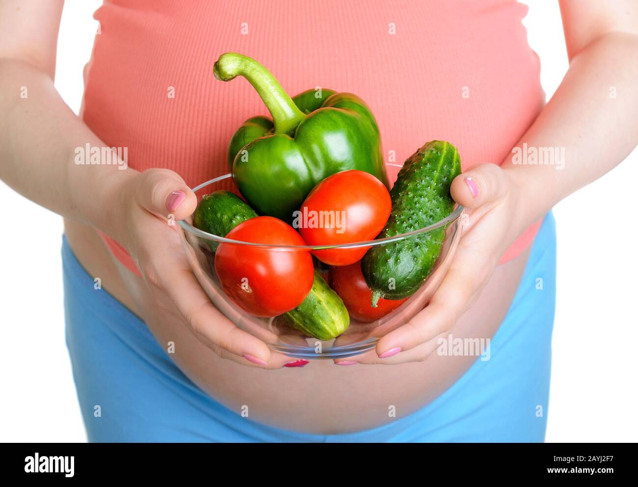 Pregnant woman with fresh vegetables isolated on white background Stock ...