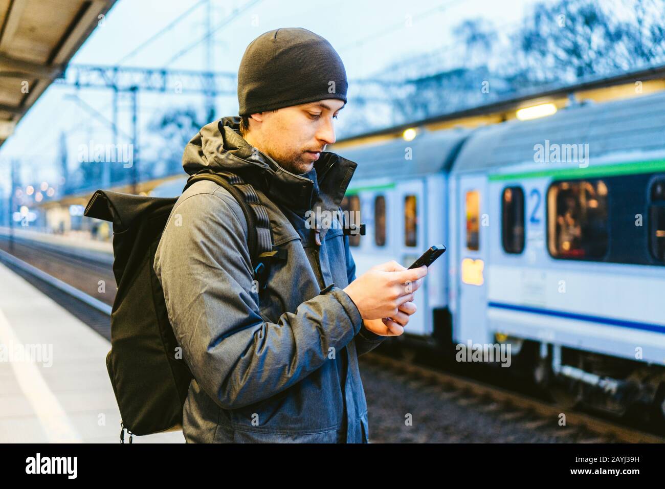 Sopot Railway station. traveler waiting for transportation. Travel concept. Man at the train station. Portrait Caucasian Male In Railway Train Station Stock Photo