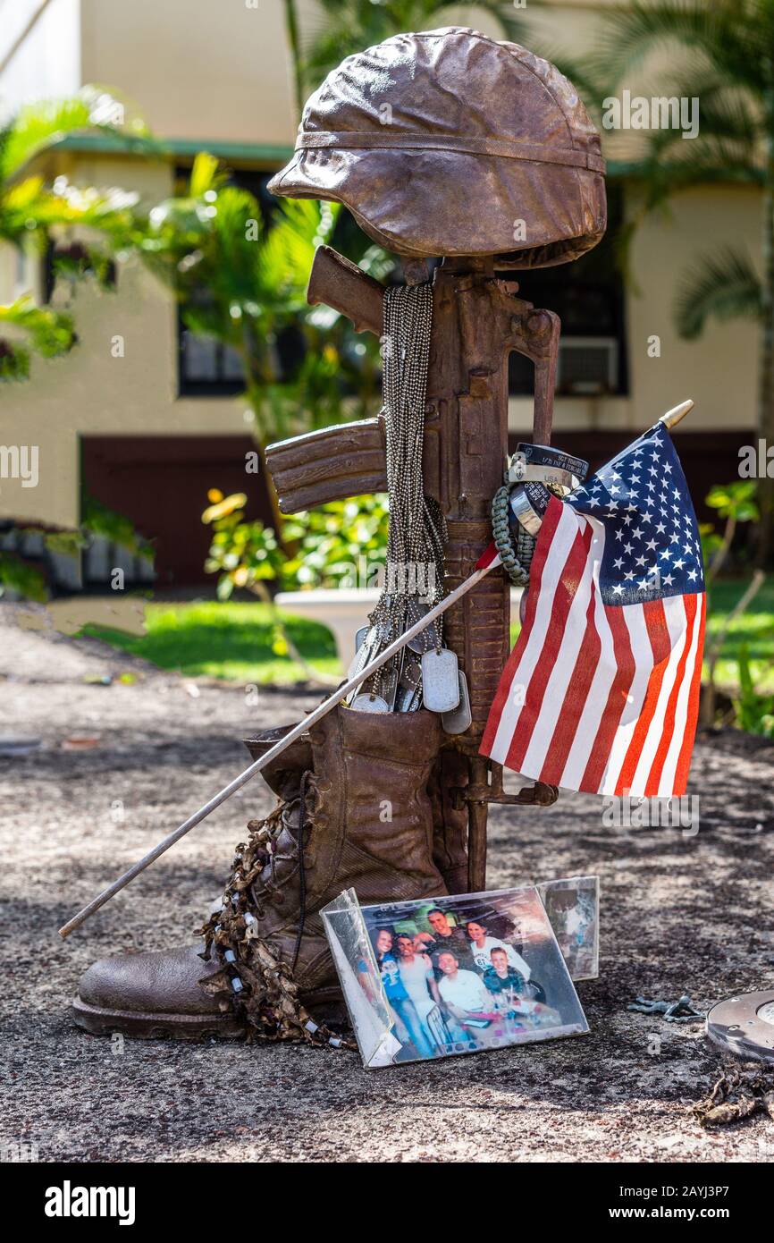 Oahu, Hawaii, USA. - January 10, 2012: Bronze helmet on rifle fallen soldier statue as part of United In Sacrifice group statue at Schofield Barracks Stock Photo