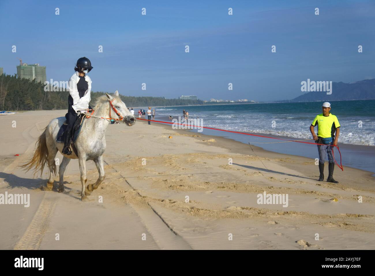 Woman riding horse into sea hi-res stock photography and images - Alamy