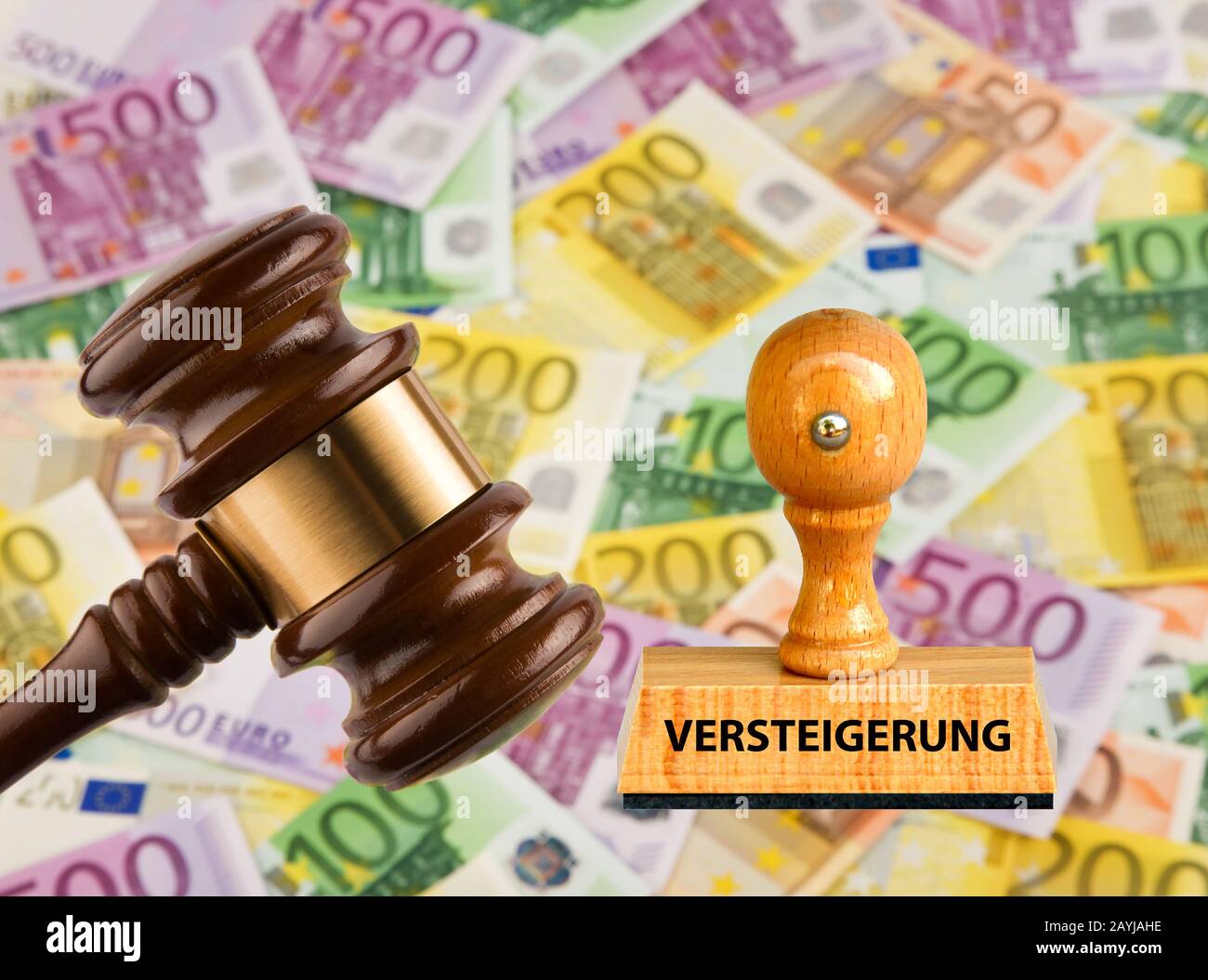 stamp lettering Versteigerung, auction, with justice hammer abd Euro bills, Germany Stock Photo