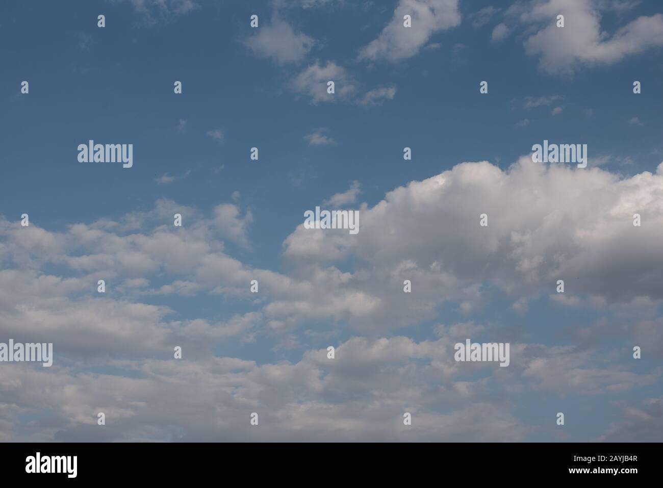 White clouds in blue summer sky background Stock Photo - Alamy