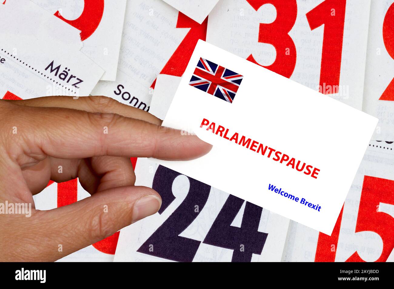 hand holding calling card with Union Jack lettering Parlamentspause, break of parliament, Welcome Brexit, composing, United Kingdom, England Stock Photo
