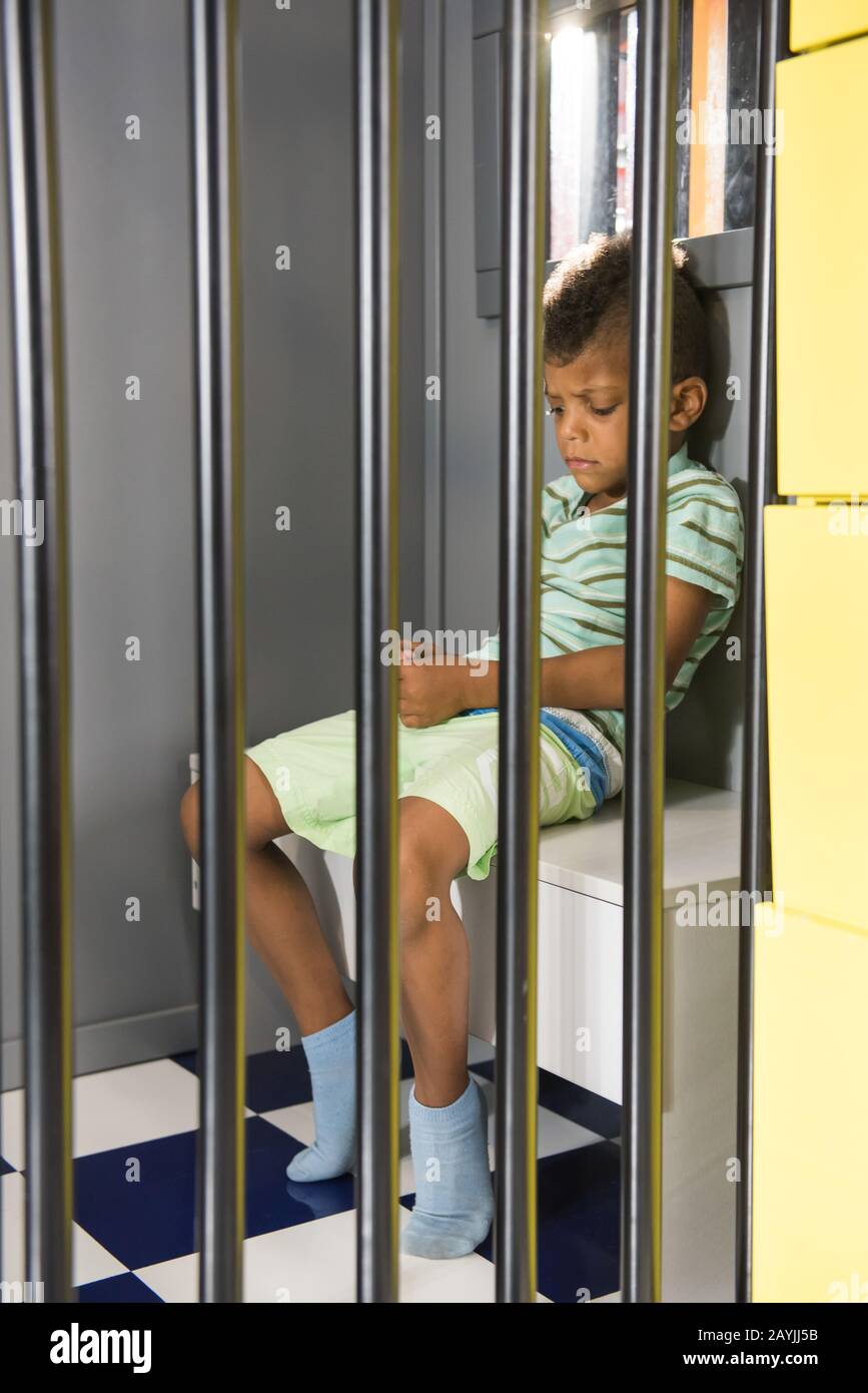Kid Prisoner Try To Escape from Jail. Stock Image - Image of