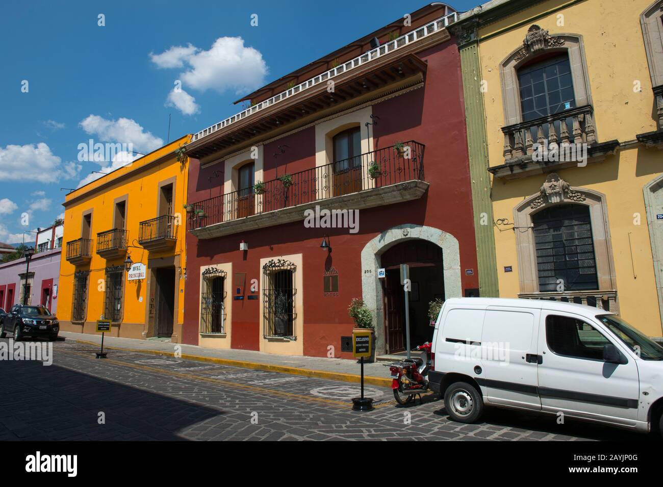 A street scene with colorful houses and the Hotel Casa Antigua in