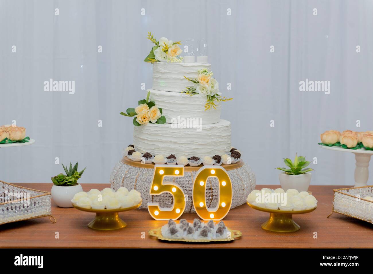 A beautiful cake for the 50th anniversary decorated. Table ...
