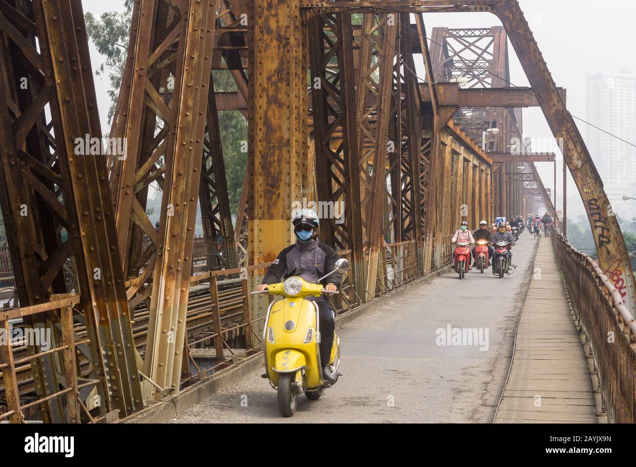 Hanoi Long Bien bridge - Motorists ride accross the historic Long Bien bridge in Hanoi, Vietnam, Southeast Asia. Stock Photo