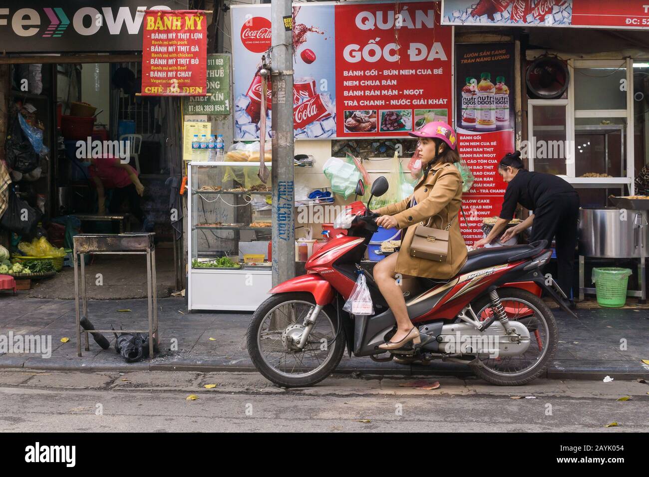 Vietnam motorbike - A woman in heels riding Honda motorbike in Hanoi,  Vietnam, Southeast Asia Stock Photo - Alamy