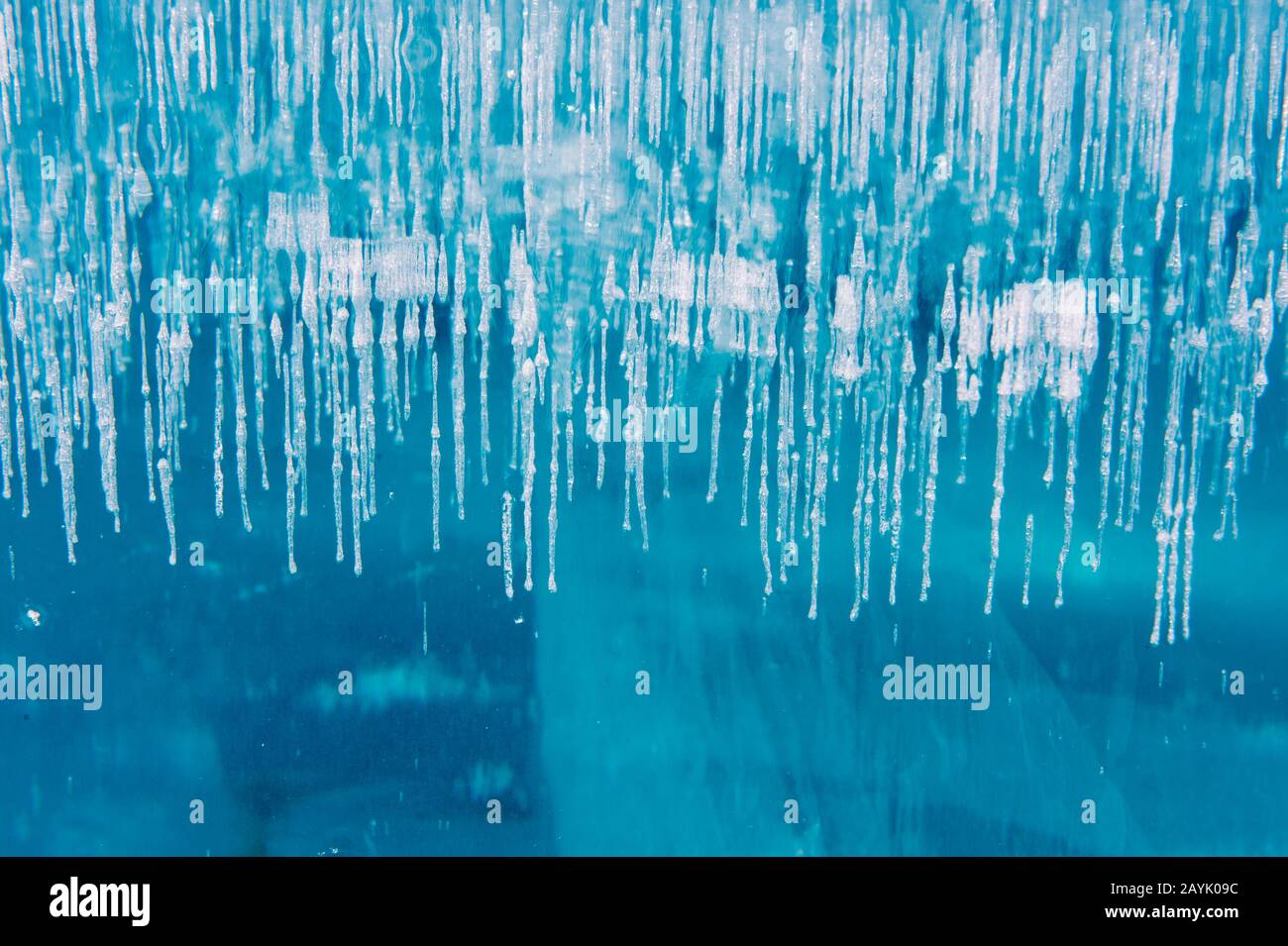 Close-up of a block of ice, looking into the inside at the structure with cracks and air bubbles, at the Icehotel in Jukkasjarvi near Kiruna in Swedis Stock Photo