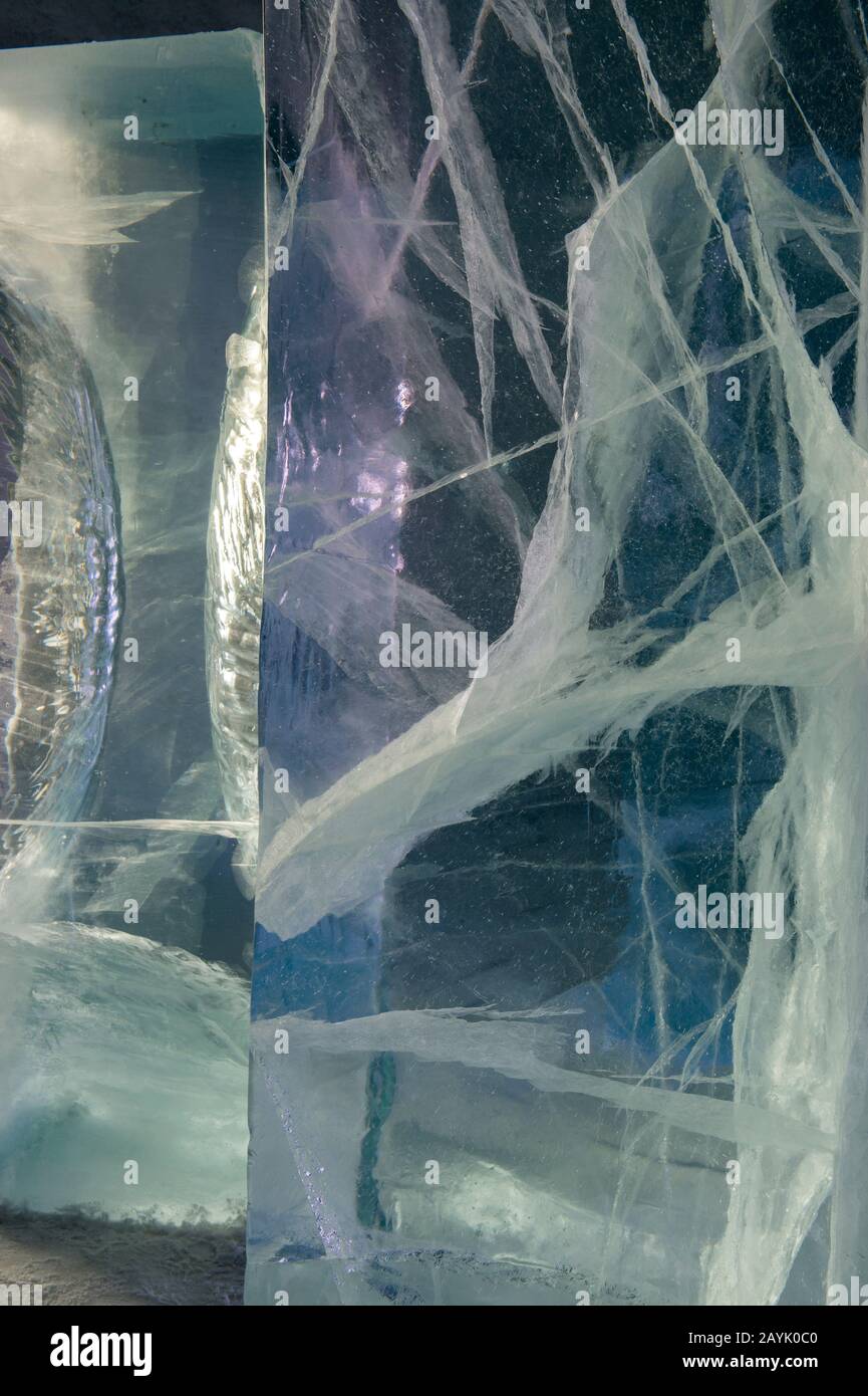 Close-up of a block of ice, looking into the inside at the structure with cracks and air bubbles, at the Icehotel in Jukkasjarvi near Kiruna in Swedis Stock Photo