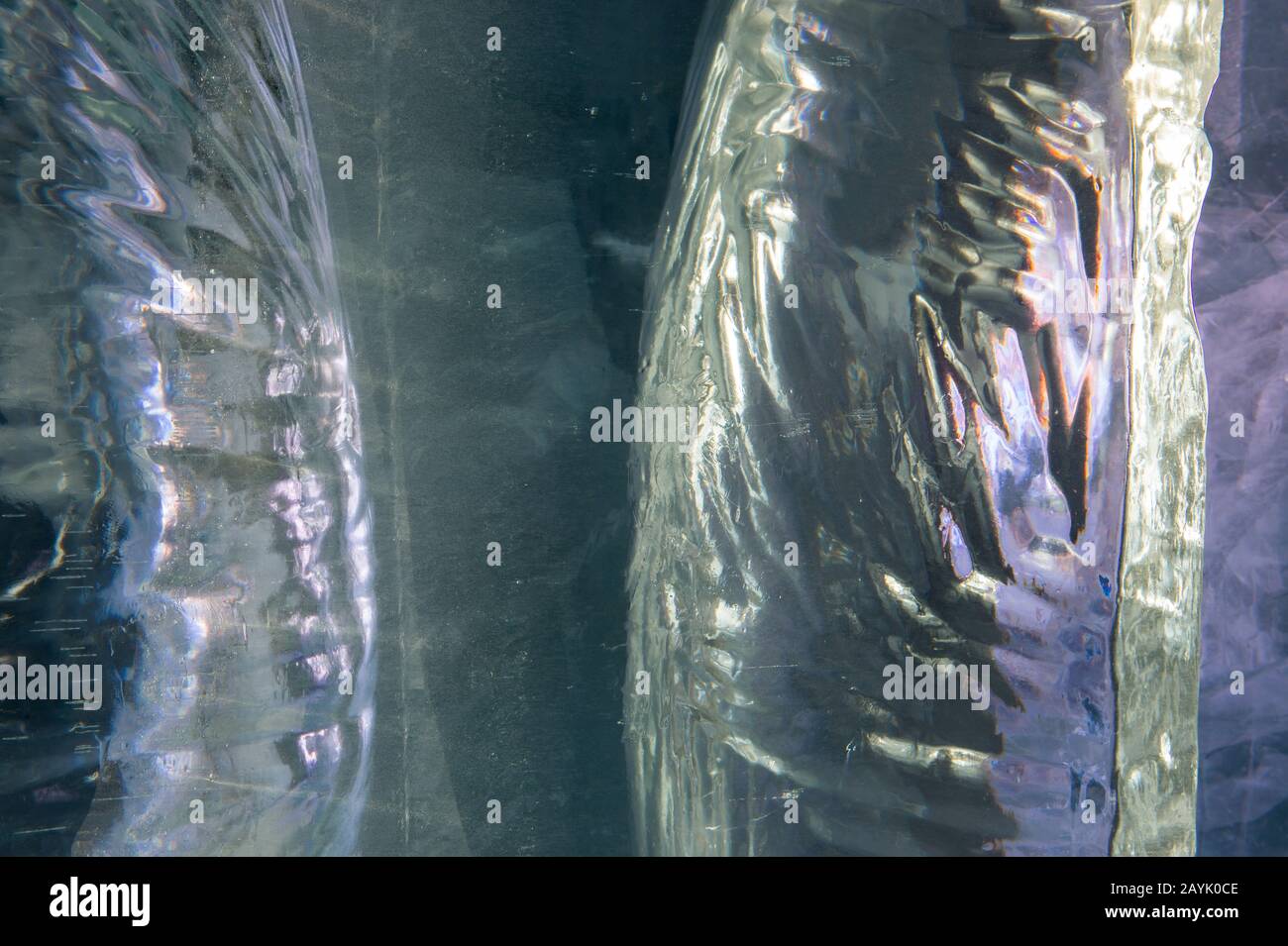 Close-up of a block of ice, looking into the inside at the structure with cracks and air bubbles, at the Icehotel in Jukkasjarvi near Kiruna in Swedis Stock Photo