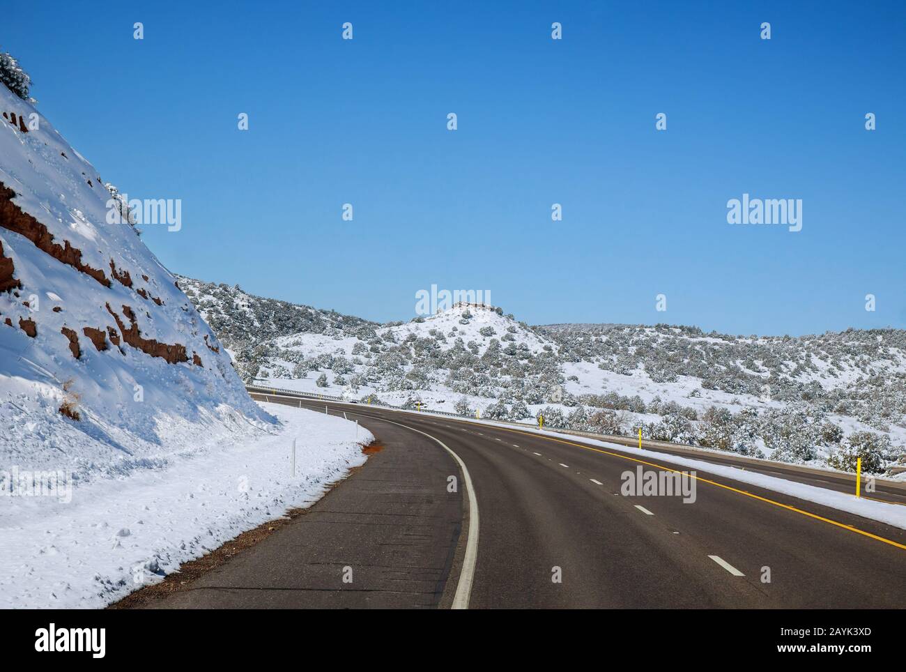 Empty road snow covered mountains hi-res stock photography and images ...