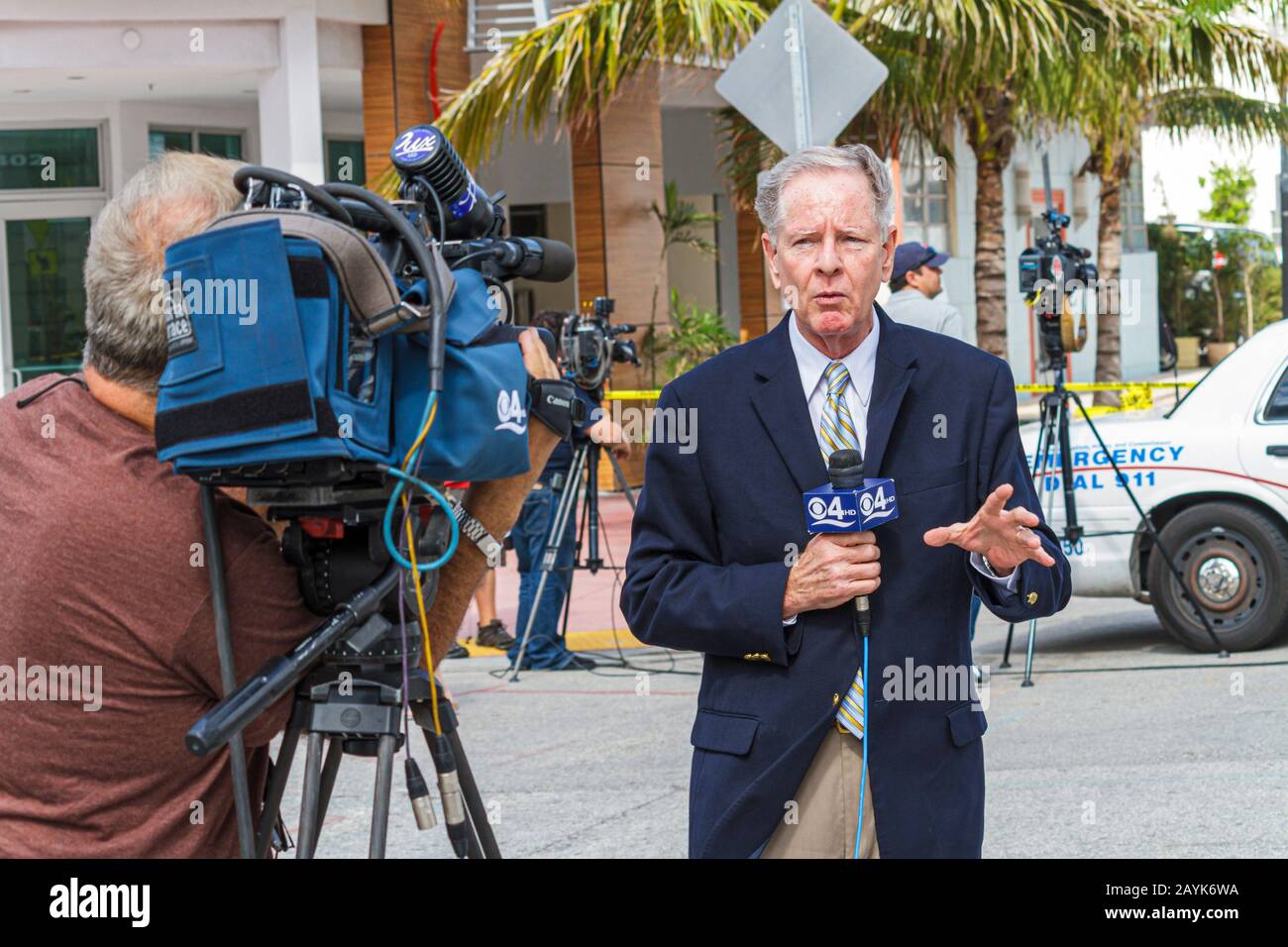 Miami Beach Florida,Ocean Drive,shooting crime murder,media,journalist,reporter,media,interview,interviews,cameraman,digital video videocam camcorder Stock Photo