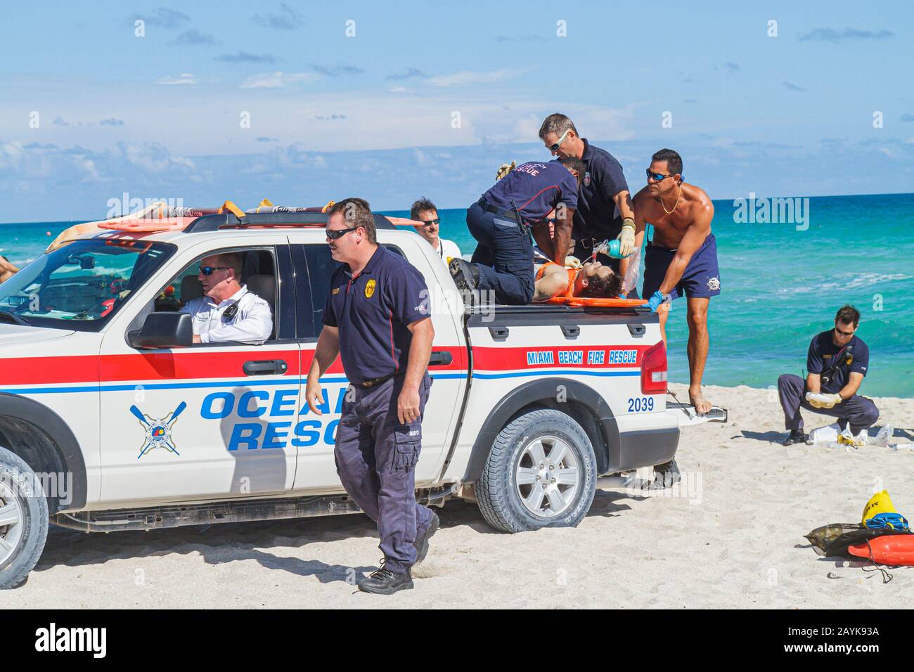 Miami Beach Florida,Atlantic Ocean,water,fire rescue,emergency,CPR,cardiopulmonary resuscitation,drowning,victim,rough surf,man men male,rip currents Stock Photo