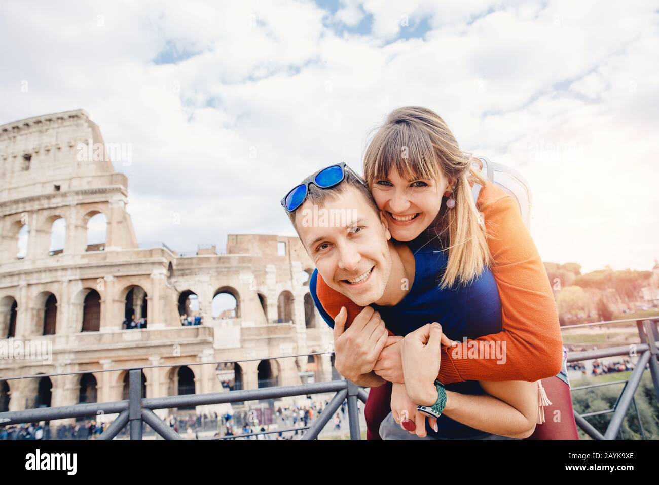 Travel couple man and girl taking selfie photo Colosseum landmark in Rome city. Concept europe Italy summer, people smiling Stock Photo