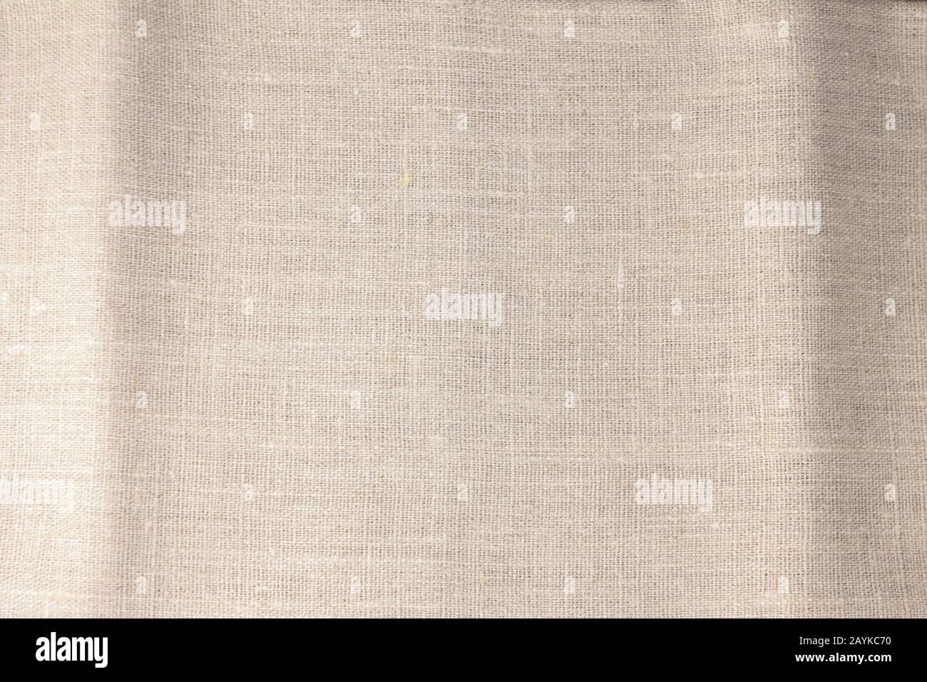 Beige linen fabric cotton for wallpaper design. Brown weave cotton background texture. Stock Photo