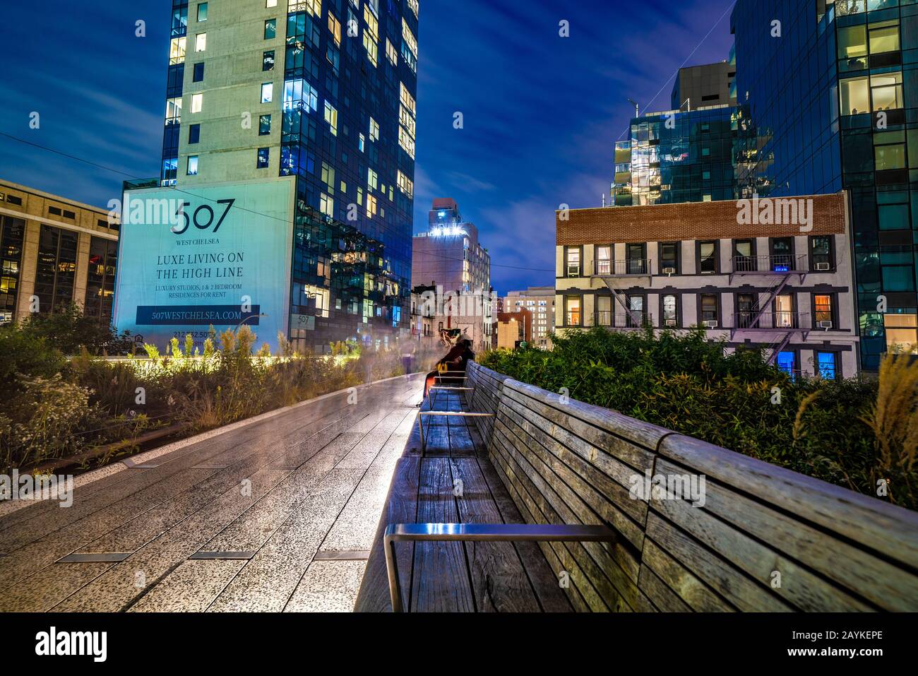 NEW YORK, USA - OCTOBER 13: Night view of a walking path and city buildings  at the High Line, an elevated park in Manhattan on October 13, 2019 in New  Stock Photo - Alamy