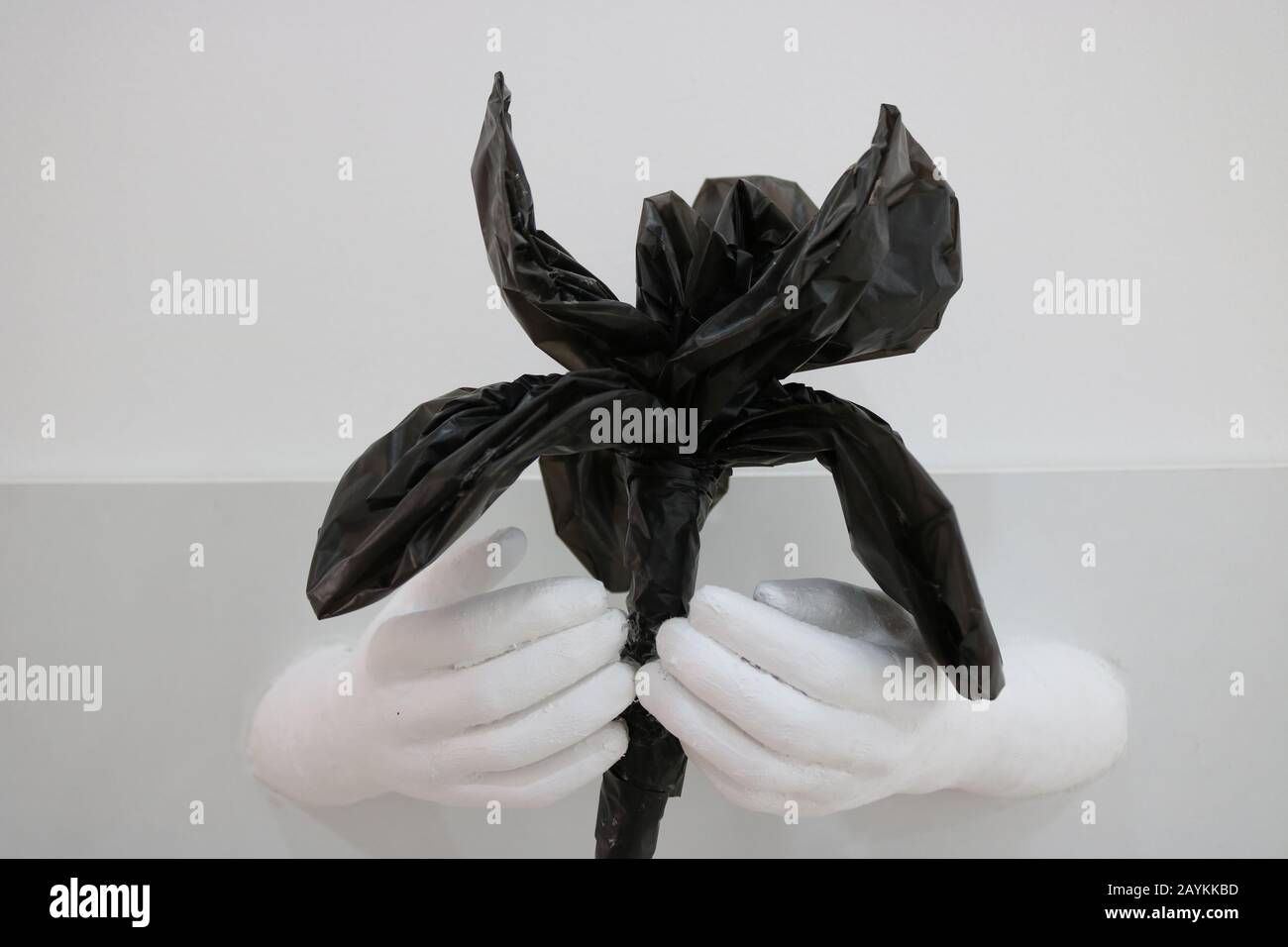 the black plastic bag was made as flower to increase awareness about this issue Stock Photo