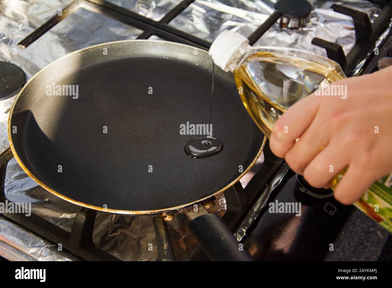 Oil pouring into a pan hires stock photography and images Alamy