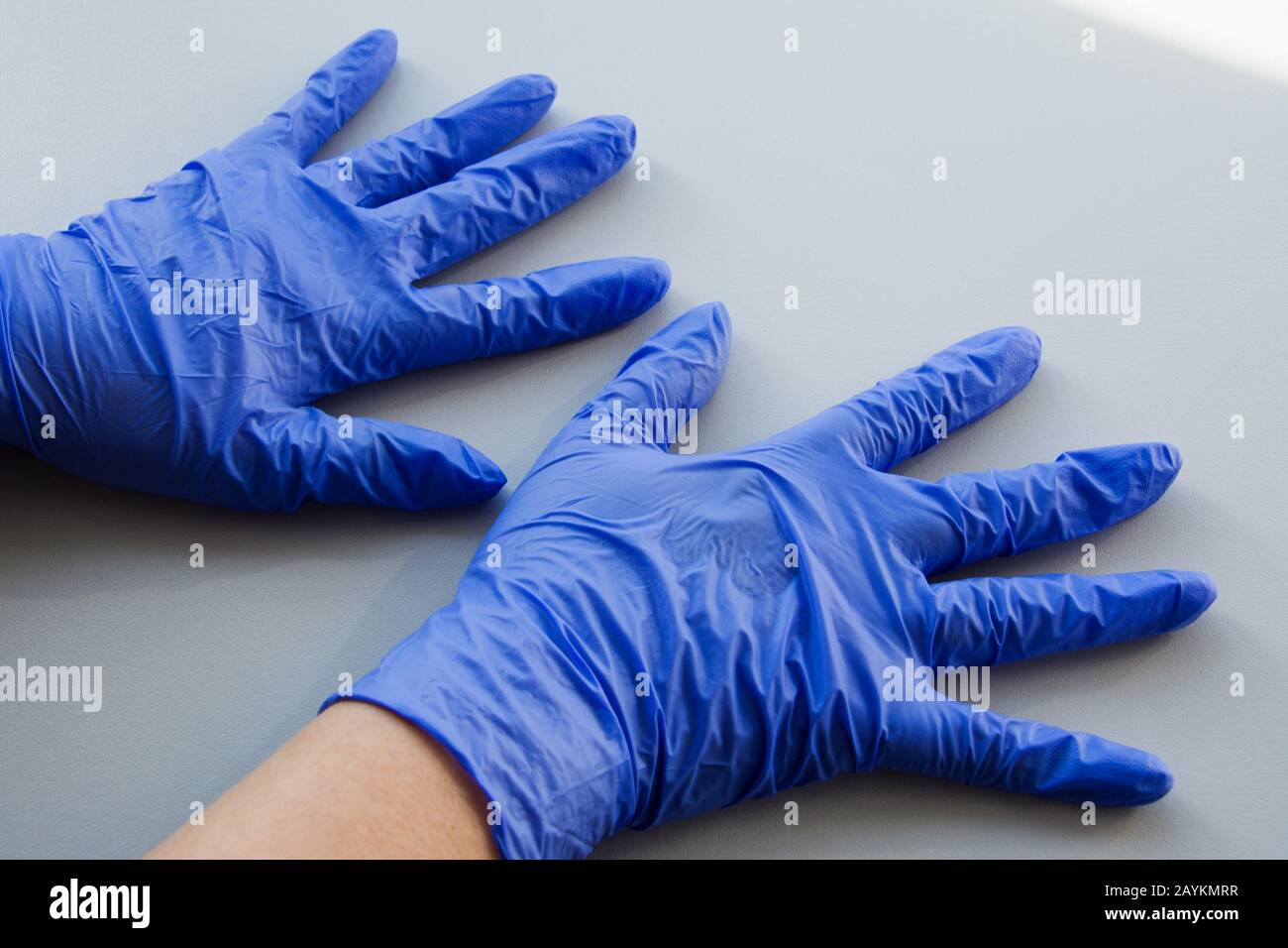 Two hand in blue latex glove, personal protective equipment medical