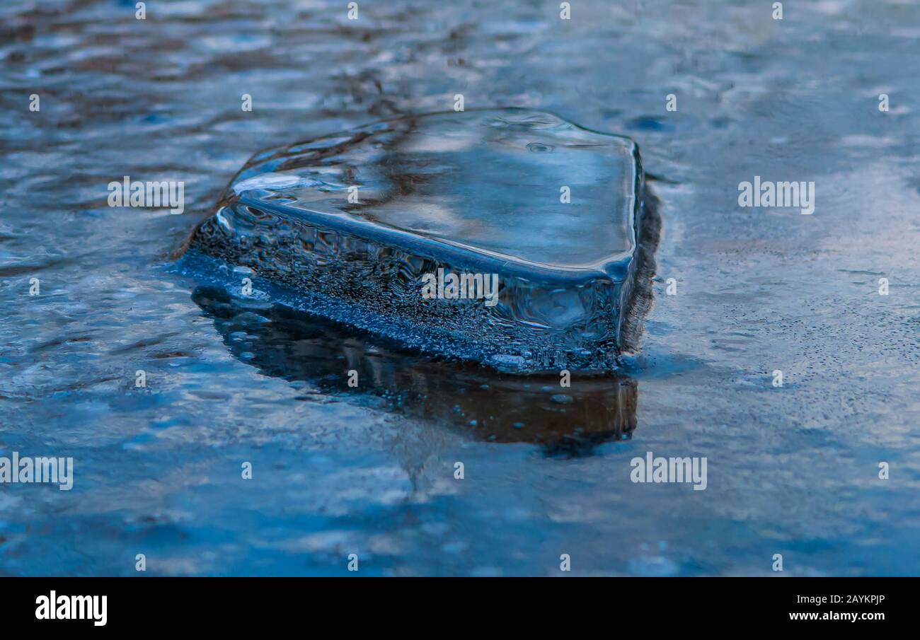 Piece of ice in surface of frozen lake Stock Photo