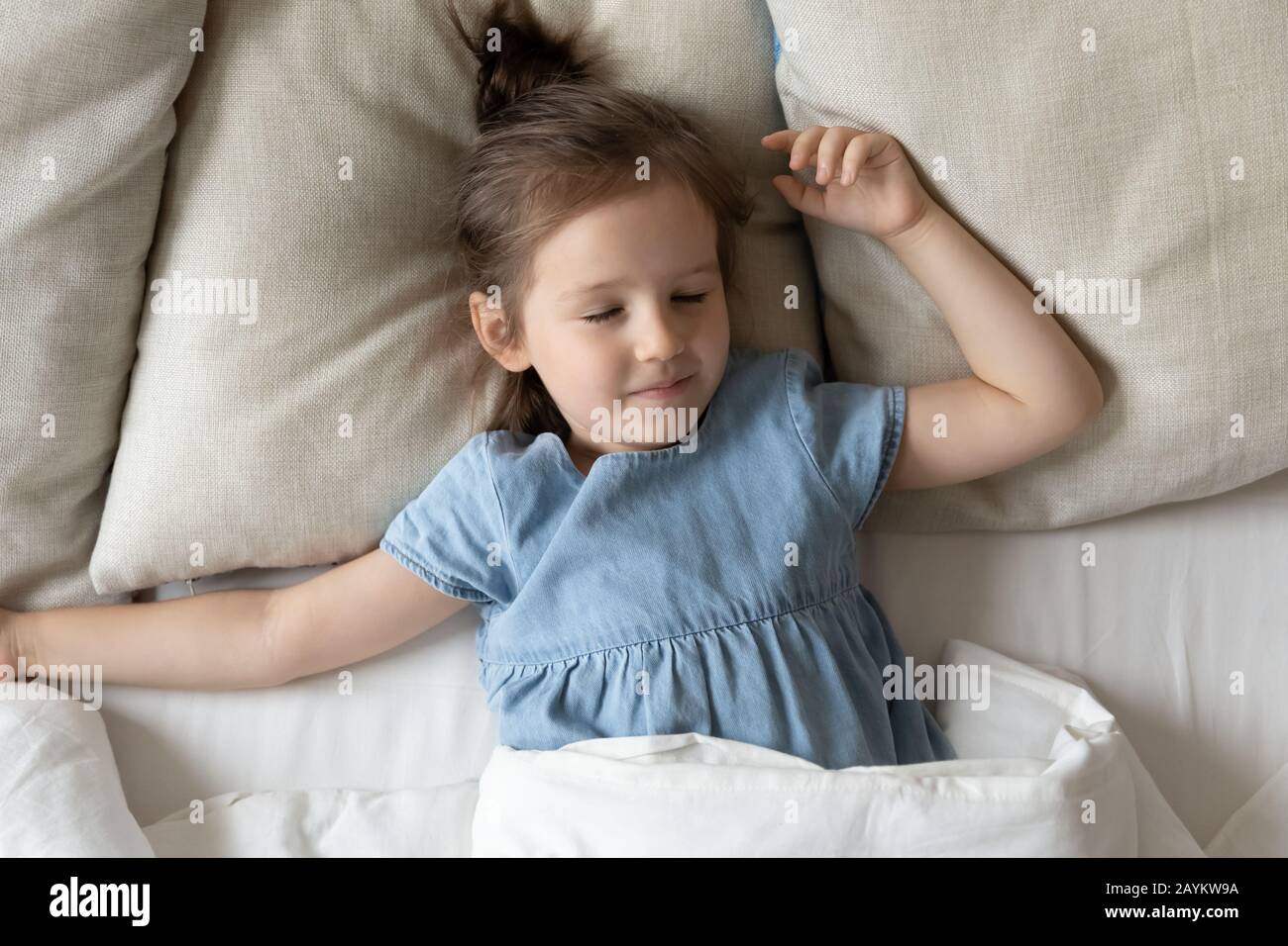 Peaceful little preschool girl sleeping in bed Stock Photo Alamy