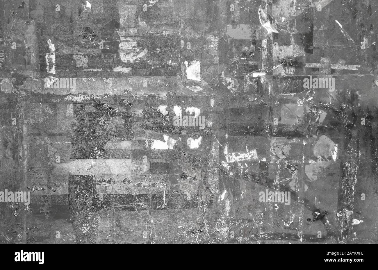 Ripped posters background. Paper remaining on advertisement billboard ...