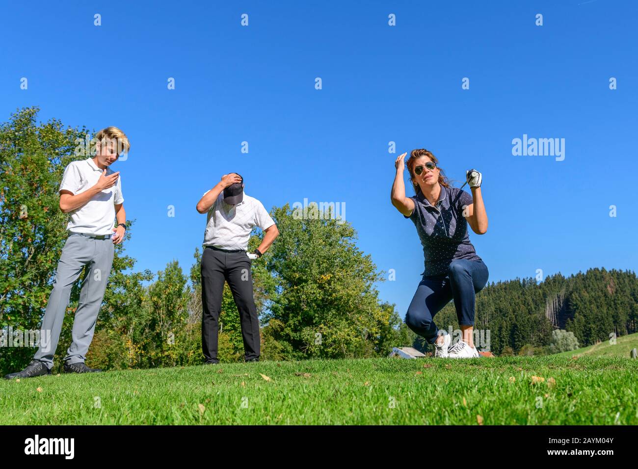 Feamle golf player is grieved about mishit from tee Stock Photo