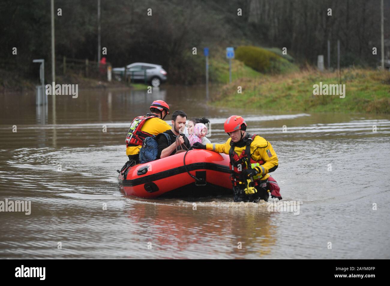 Rescue operations underway and a family is taken to safety, after flooding in Nantgarw, Wales as Storm Dennis hit the UK. Stock Photo