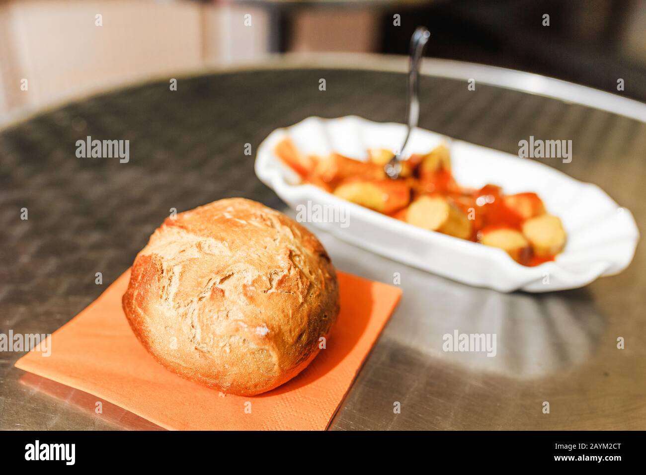 Curry wurst or bratwurst sausage with mustard sauce, local german