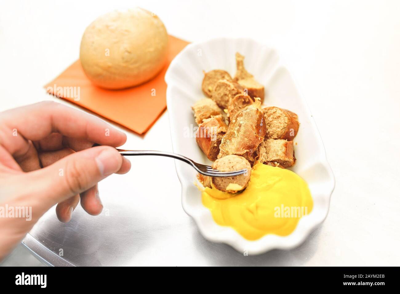 Curry wurst or bratwurst sausage with mustard sauce, local german