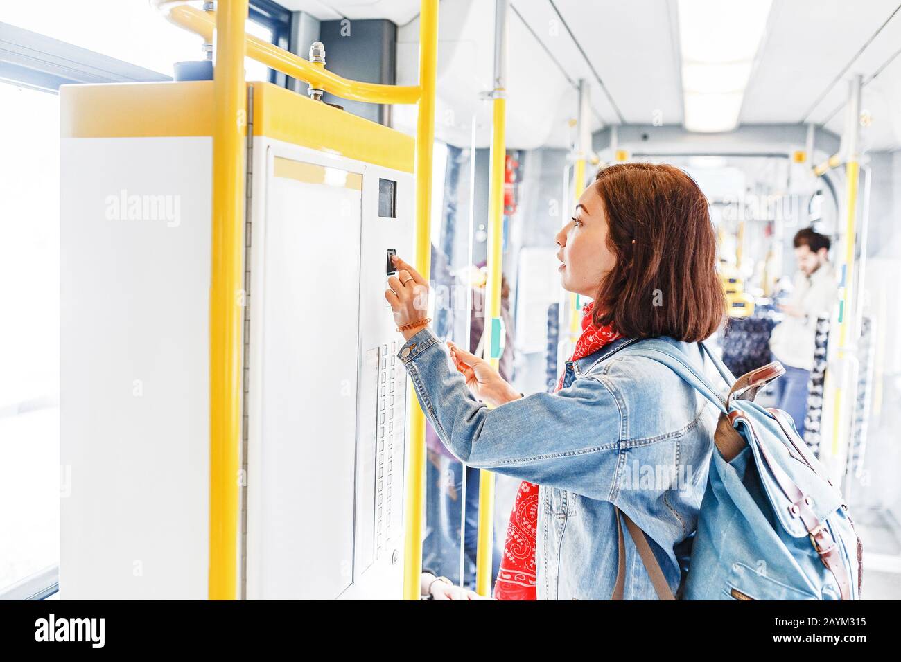 Woman buying ticket in tram or bus. public transport concept Stock