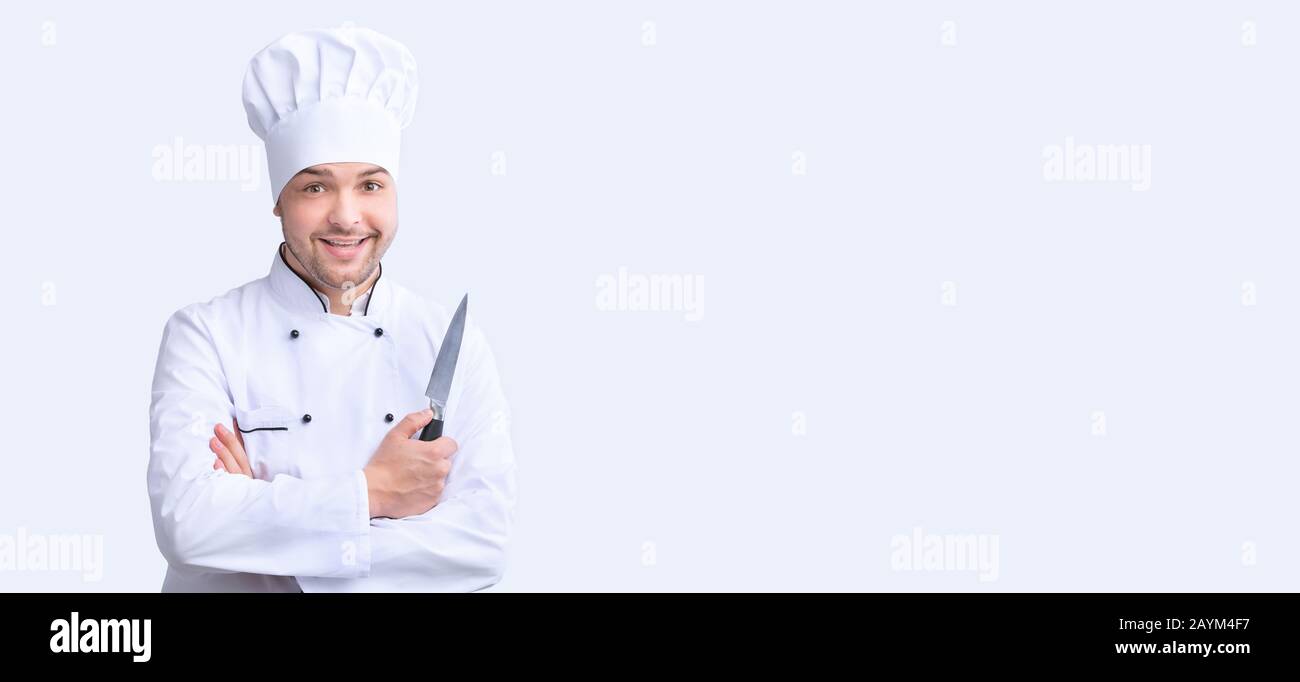 Professional Chef Holding Knife Posing On White Background, Panorama Stock Photo