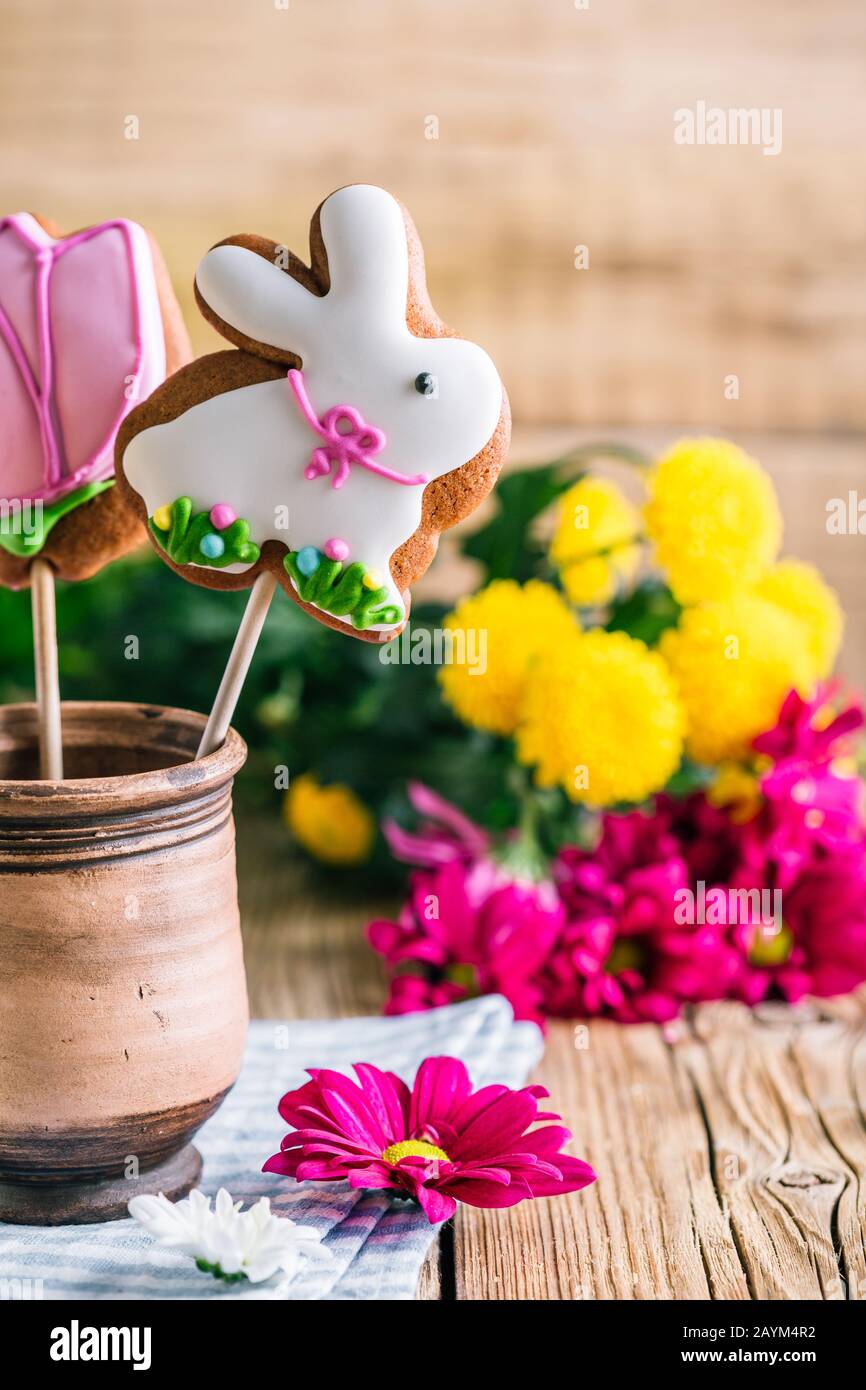 Easter gingerbread rabbit on wooden background Stock Photo