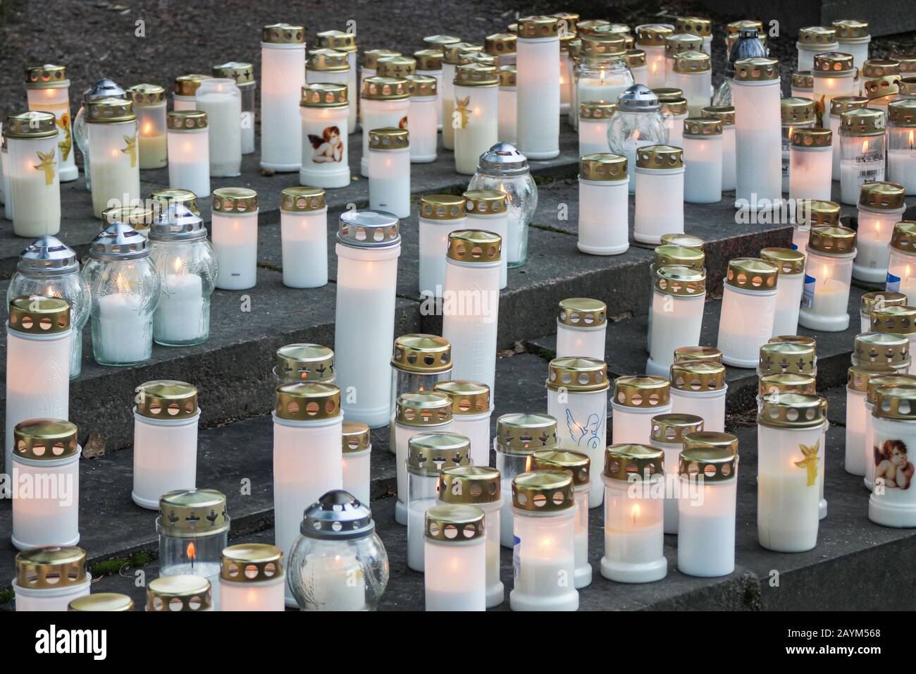 Grave candles at remembrance place for those buried elsewhere on Christmas Eve Stock Photo