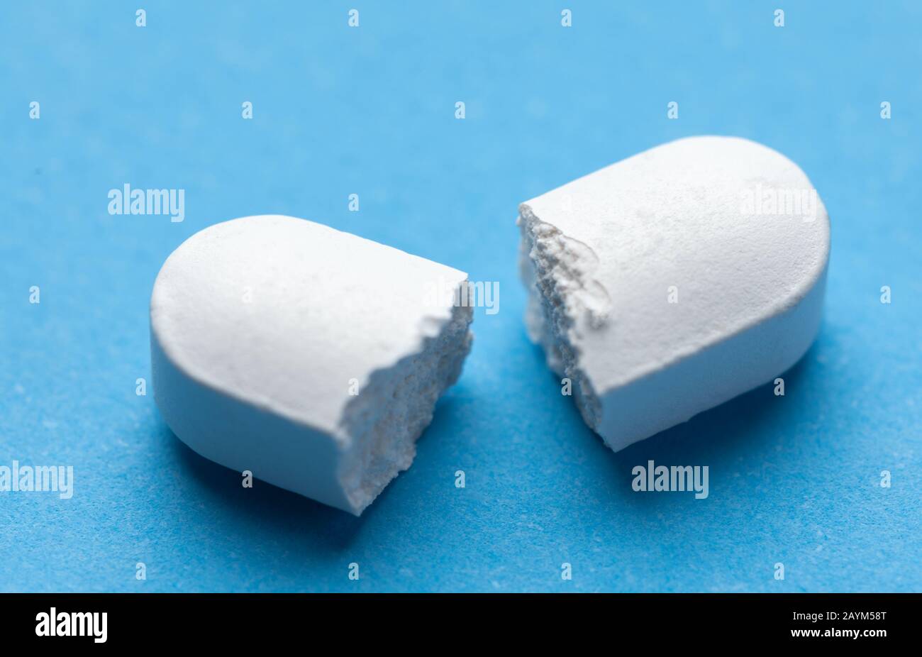 Pill broken on half. Pharmacy medicament concept Stock Photo Alamy