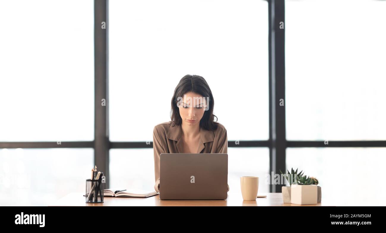 Beautiful girl working on her laptop at home Stock Photo - Alamy
