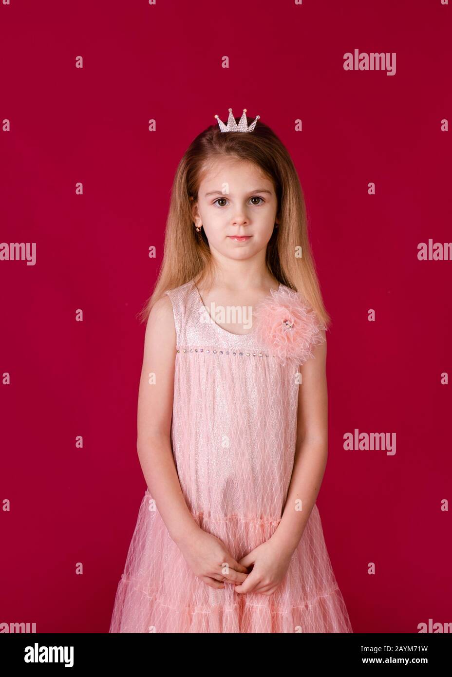Beautiful little girl princess dancing in luxury pink and silver dress ...