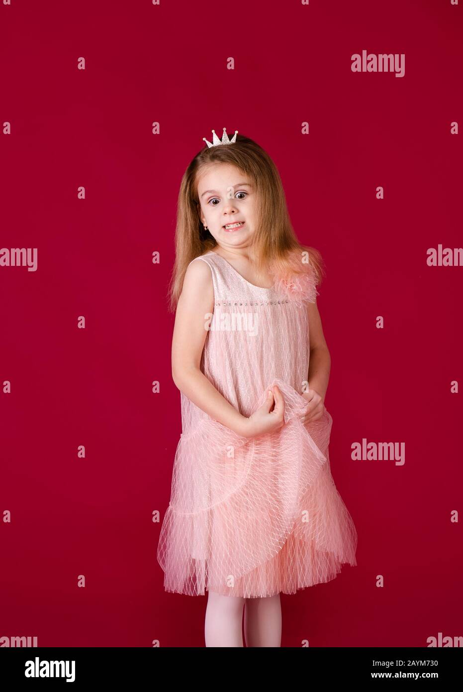 Beautiful little girl princess dancing in luxury pink and silver dress ...