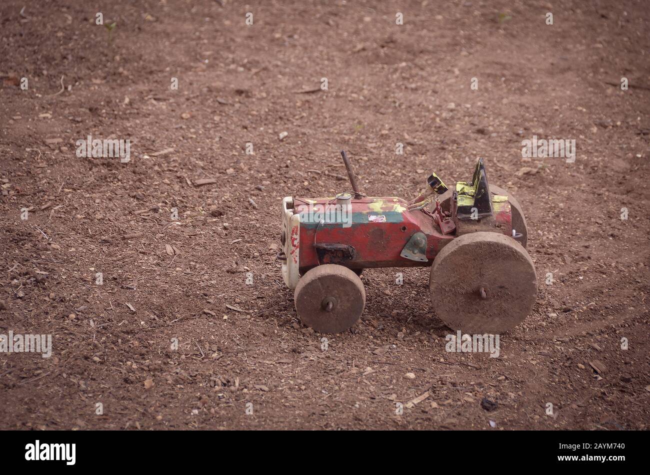 DIY wooden toy tractor made with recyclable materials.Happiness is
