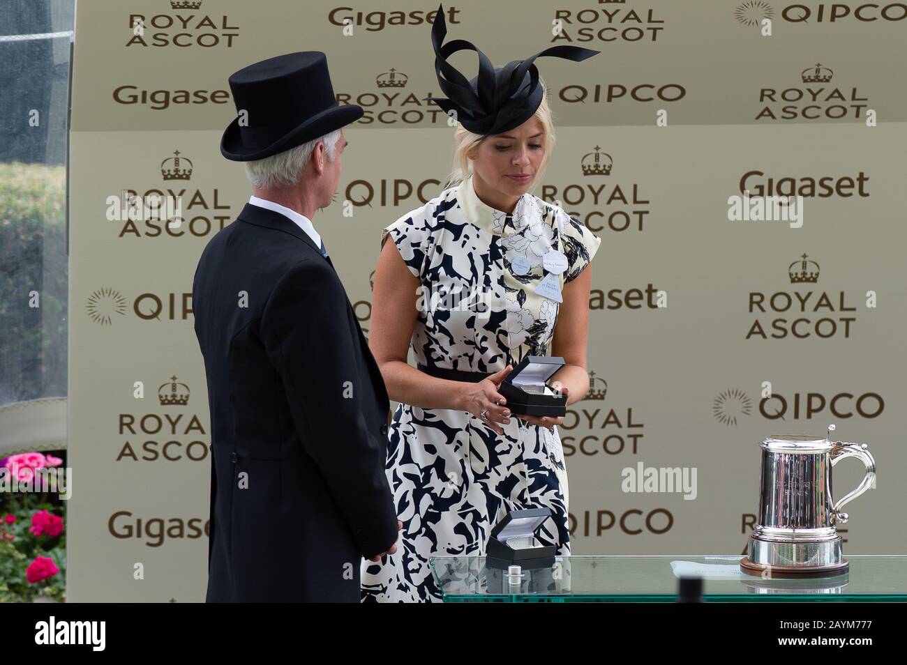 Day Four, Royal Ascot, Ascot, Berkshire, UK. 23rd June, 2017. ITV This Morning Television presenters Phillip Schofield and Holly Willoughby present the winning owners and trainers  of the King Edward VII Stakes with their prizes. The race was won by jockey Adam Kirby on horse Permian. Credit: Maureen McLean/Alamy Stock Photo