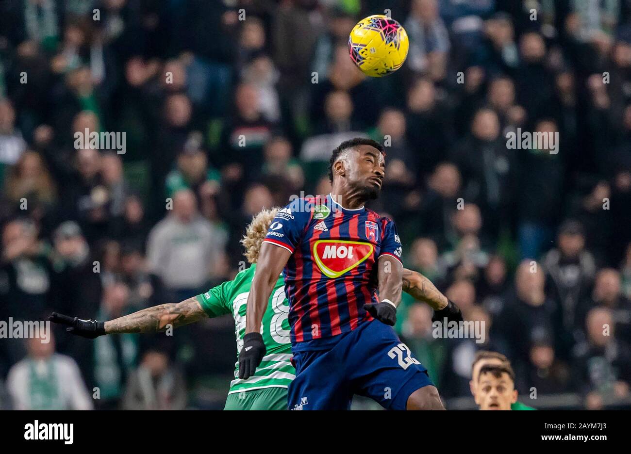 Ivan Petryak of MOL Fehervar FC dribbles between Franck Boli of